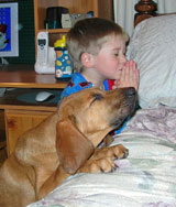 a boy and his dog at prayer